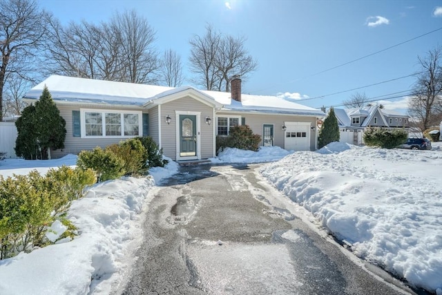 single story home with a garage