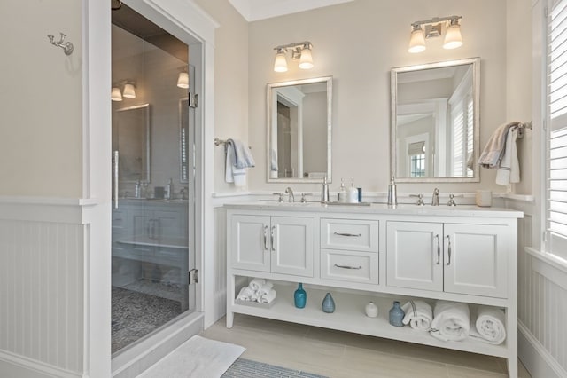 bathroom with tile patterned flooring, vanity, and an enclosed shower