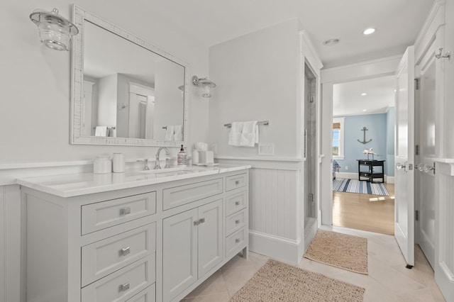 bathroom with hardwood / wood-style floors and vanity