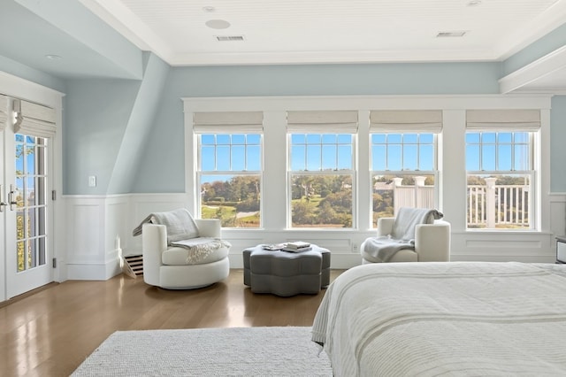 bedroom featuring hardwood / wood-style flooring and ornamental molding