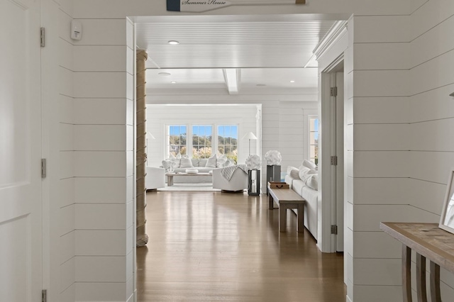 corridor with hardwood / wood-style flooring