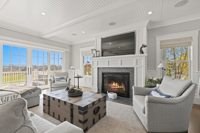 living room with beam ceiling, wooden ceiling, and crown molding