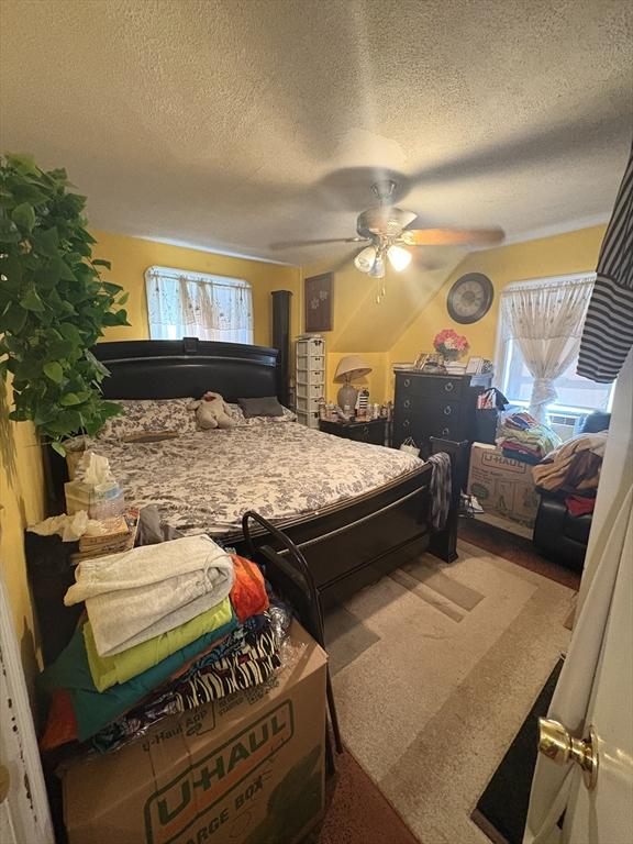 12 Graves Ave, Lynn, MA 01902 - bedroom featuring a textured ceiling and a ceiling fan