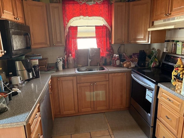 12 Graves Ave, Lynn, MA 01902 - kitchen featuring stainless steel electric range, black microwave, under cabinet range hood, a sink, and tasteful backsplash