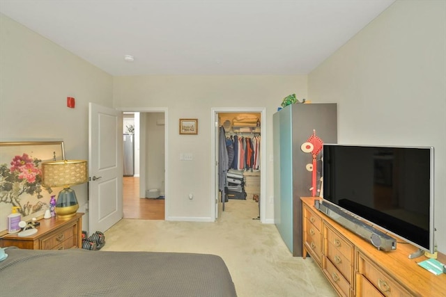 110 Trotter Rd Unit 104, Weymouth, MA 02190 - bedroom featuring a walk in closet, light colored carpet, and a closet