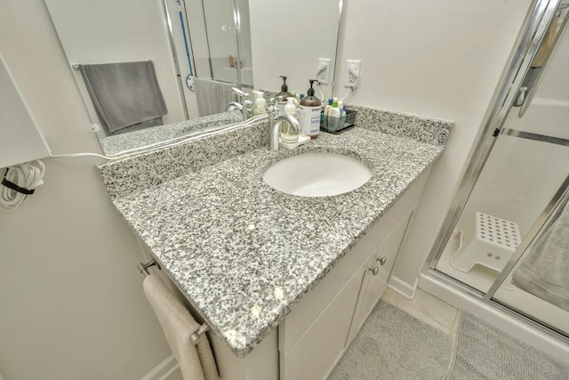 110 Trotter Rd Unit 104, Weymouth, MA 02190 - full bathroom with a shower stall, vanity, and tile patterned floors