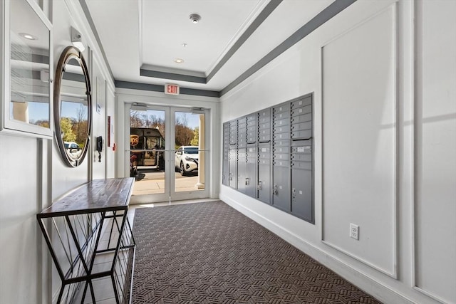 110 Trotter Rd Unit 104, Weymouth, MA 02190 - hallway with mail area, french doors, a raised ceiling, crown molding, and carpet floors
