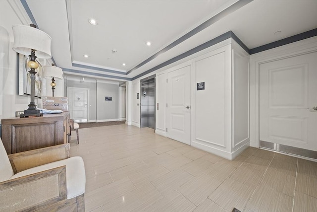 110 Trotter Rd Unit 104, Weymouth, MA 02190 - hallway featuring elevator, a tray ceiling, ornamental molding, and recessed lighting