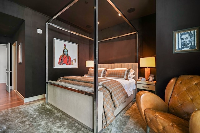 bedroom featuring hardwood / wood-style flooring and a closet