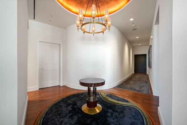 corridor with dark hardwood / wood-style flooring