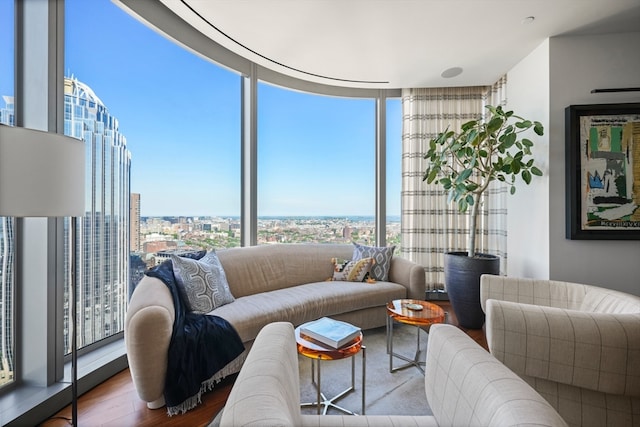 living room featuring expansive windows and hardwood / wood-style floors