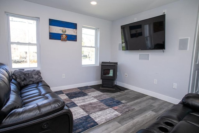 32 Leverett Rd, Shutesbury, MA 01072 - living area featuring a wood stove, baseboards, wood finished floors, and recessed lighting