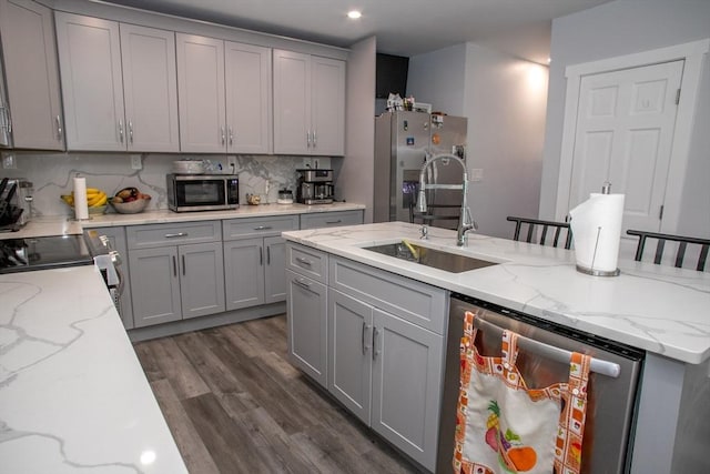 32 Leverett Rd, Shutesbury, MA 01072 - kitchen with stainless steel appliances, a sink, gray cabinetry, backsplash, and dark wood-style flooring