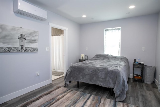 32 Leverett Rd, Shutesbury, MA 01072 - bedroom featuring an AC wall unit, wood finished floors, baseboards, and recessed lighting