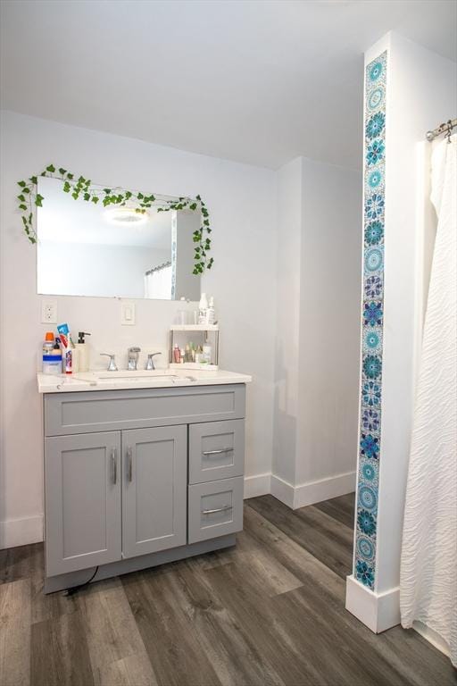 32 Leverett Rd, Shutesbury, MA 01072 - bathroom with baseboards, wood finished floors, and vanity