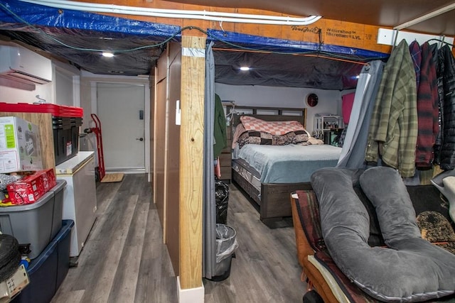 32 Leverett Rd, Shutesbury, MA 01072 - bedroom featuring wood finished floors and a wall unit AC