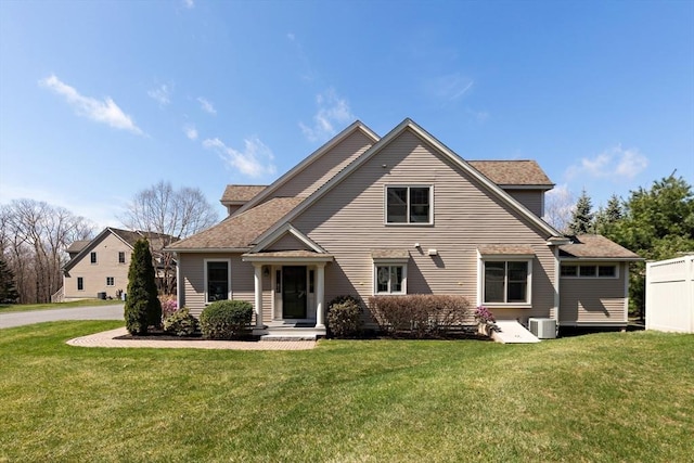 44 Sunset Ridge Ln Unit 44, Bolton, MA 01740 - back of house with a yard, central AC, and a shingled roof