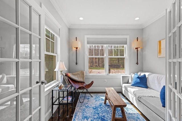 44 Sunset Ridge Ln Unit 44, Bolton, MA 01740 - living area with healthy amount of natural light, crown molding, wood finished floors, baseboards, and french doors