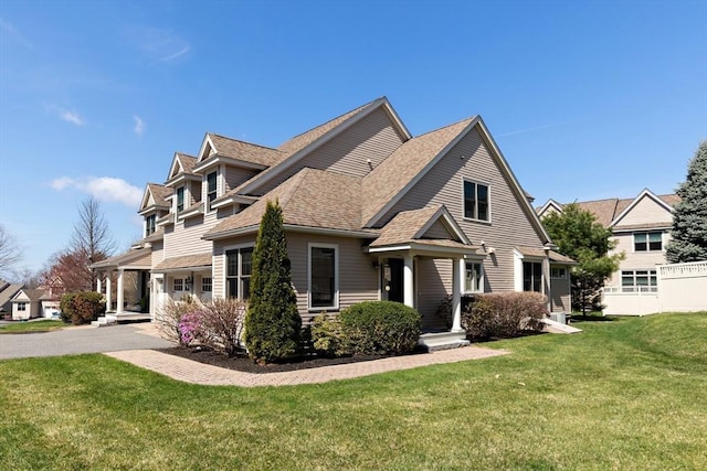 44 Sunset Ridge Ln Unit 44, Bolton, MA 01740 - view of front of property featuring a shingled roof and a front yard