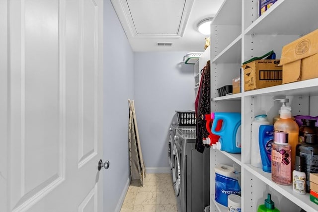 44 Sunset Ridge Ln Unit 44, Bolton, MA 01740 - laundry area featuring washer and dryer, marble finish floors, baseboards, and attic access