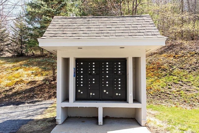 44 Sunset Ridge Ln Unit 44, Bolton, MA 01740 - exterior view of mail area and a shingled roof