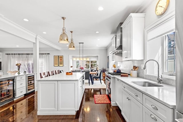 44 Sunset Ridge Ln Unit 44, Bolton, MA 01740 - kitchen featuring a sink, stainless steel stove, beverage cooler, dark wood-style flooring, and recessed lighting