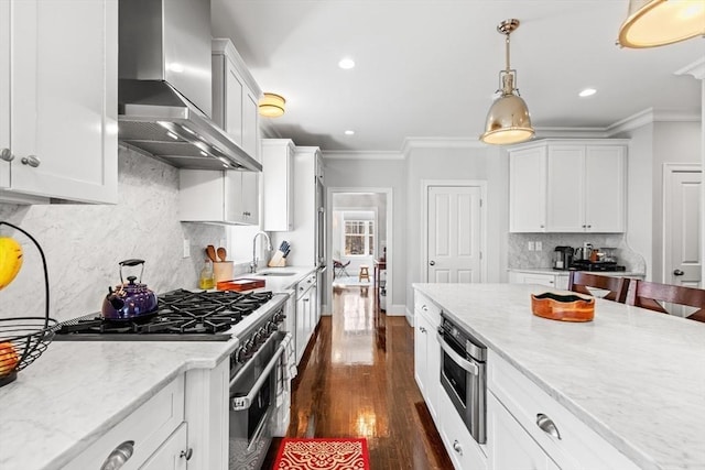 44 Sunset Ridge Ln Unit 44, Bolton, MA 01740 - kitchen with wall chimney exhaust hood, appliances with stainless steel finishes, a sink, crown molding, and dark wood-style floors