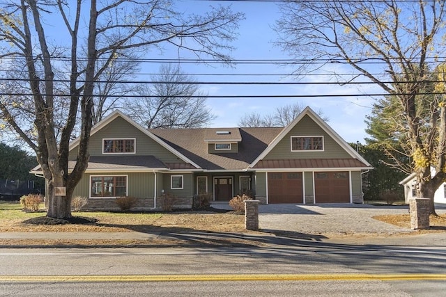 craftsman inspired home featuring stone siding and gravel driveway