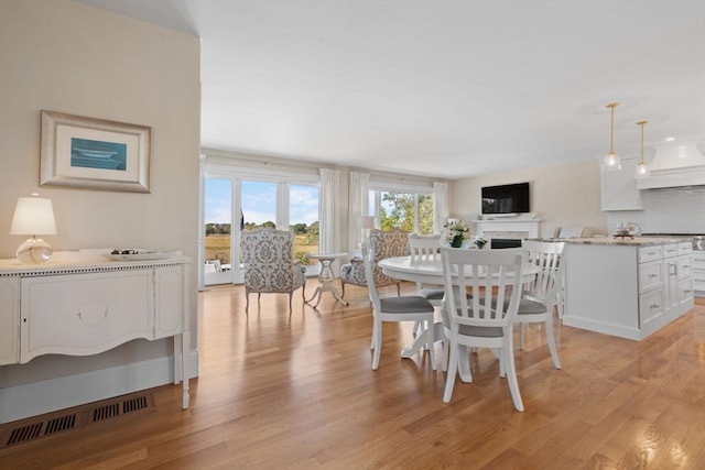 dining room featuring light hardwood / wood-style floors