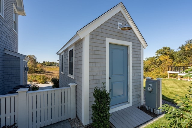 view of outbuilding featuring a lawn