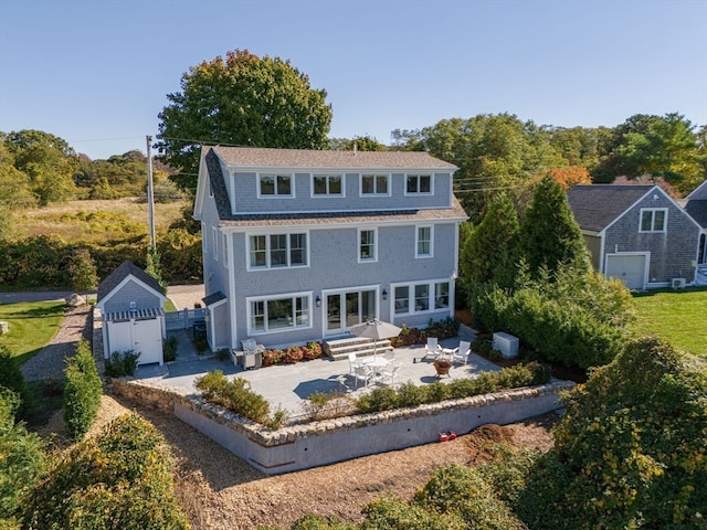 rear view of property featuring a patio area