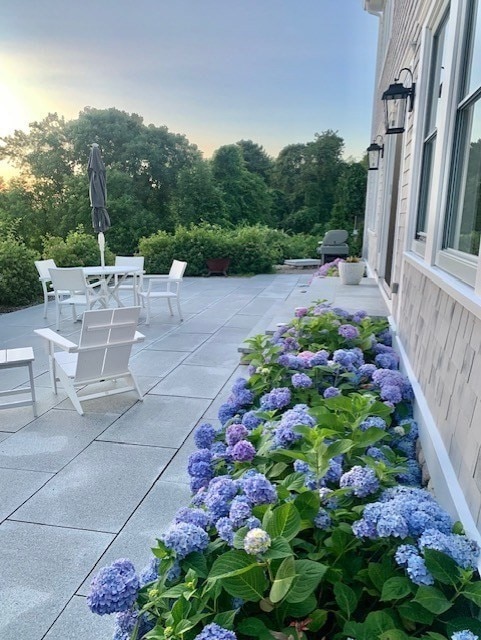 view of patio terrace at dusk