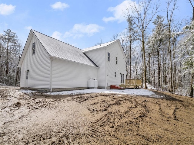 view of home's exterior featuring roof with shingles