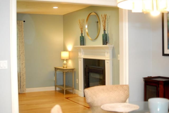 9 Pine Grove Rd, Westford, MA 01886 - sitting room featuring a glass covered fireplace and wood finished floors
