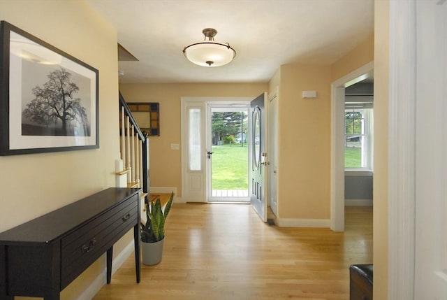 9 Pine Grove Rd, Westford, MA 01886 - doorway to outside featuring stairway, baseboards, and light wood-type flooring