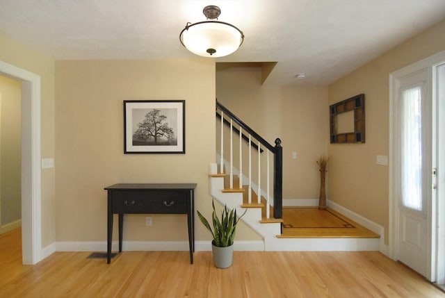 9 Pine Grove Rd, Westford, MA 01886 - foyer entrance featuring baseboards, wood finished floors, and stairway