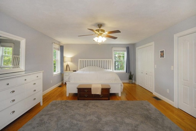 9 Pine Grove Rd, Westford, MA 01886 - bedroom with baseboards, multiple windows, wood finished floors, and visible vents
