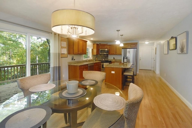 9 Pine Grove Rd, Westford, MA 01886 - dining room featuring baseboards and light wood-type flooring