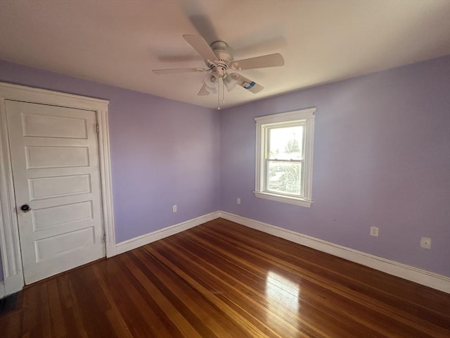 empty room with ceiling fan and hardwood / wood-style floors