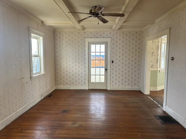 empty room with coffered ceiling, dark hardwood / wood-style flooring, ornamental molding, ceiling fan, and beamed ceiling