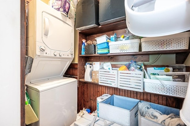 laundry area with laundry area and stacked washer / dryer