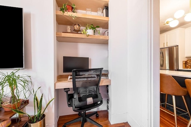 office space with wood finished floors