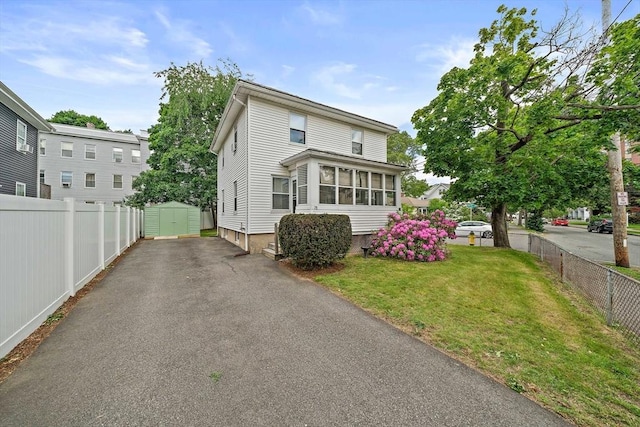 78/80 Curtis Ave, Quincy, MA 02169 - view of front of property featuring a storage shed and a fenced backyard