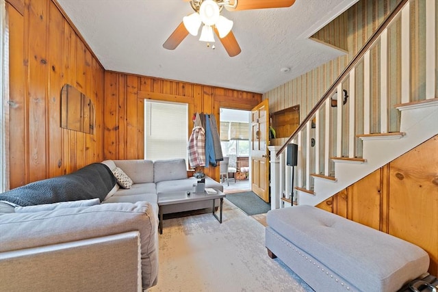 78/80 Curtis Ave, Quincy, MA 02169 - living room featuring a ceiling fan, stairs, and wood walls