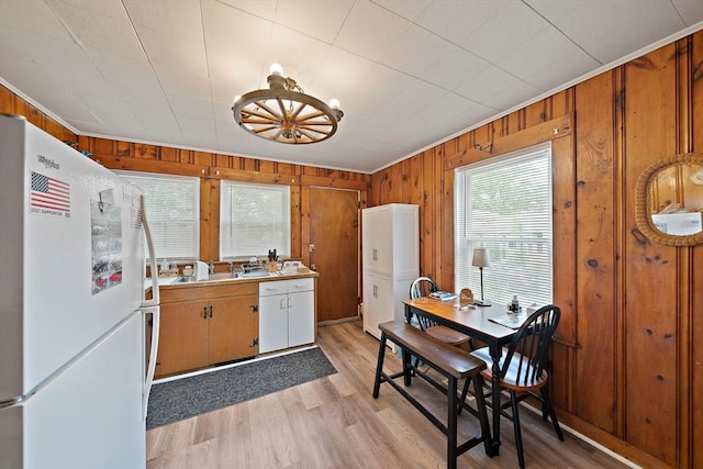 78/80 Curtis Ave, Quincy, MA 02169 - kitchen featuring freestanding refrigerator, wooden walls, light wood-style floors, light countertops, and ornamental molding