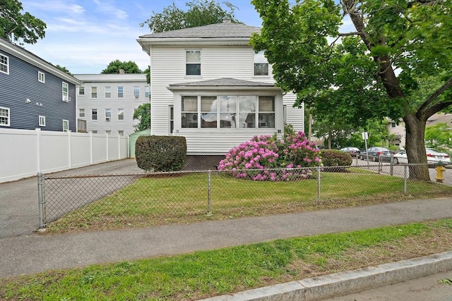 78/80 Curtis Ave, Quincy, MA 02169 - view of front of home with a fenced front yard and a shingled roof