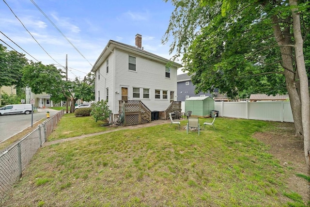 78/80 Curtis Ave, Quincy, MA 02169 - back of property with a storage unit, a chimney, and a fenced backyard