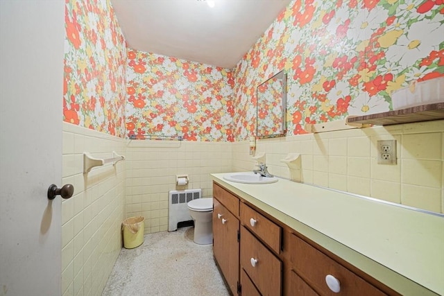 36 Grove St, Hanover, MA 02339 - bathroom featuring wallpapered walls, radiator, wainscoting, vanity, and tile walls