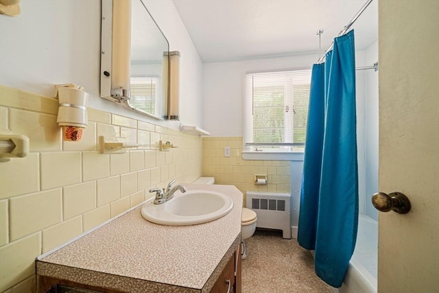 36 Grove St, Hanover, MA 02339 - bathroom with radiator, vanity, shower / bath combo with shower curtain, tile walls, and wainscoting