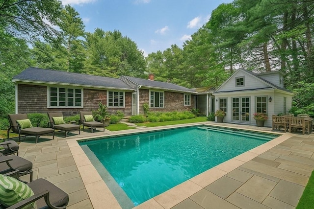 36 Grove St, Hanover, MA 02339 - swimming pool featuring an exterior structure, a patio area, an outbuilding, and french doors